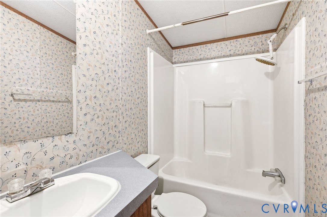 7410 Richmond Road Amelia Court House, VA 23002 - Photo 20 of 39 a bathroom with a sink toilet and shower