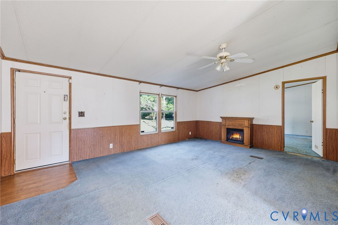 7410 Richmond Road Amelia Court House, VA 23002 - Photo 6 of 39 an empty room with windows and closet