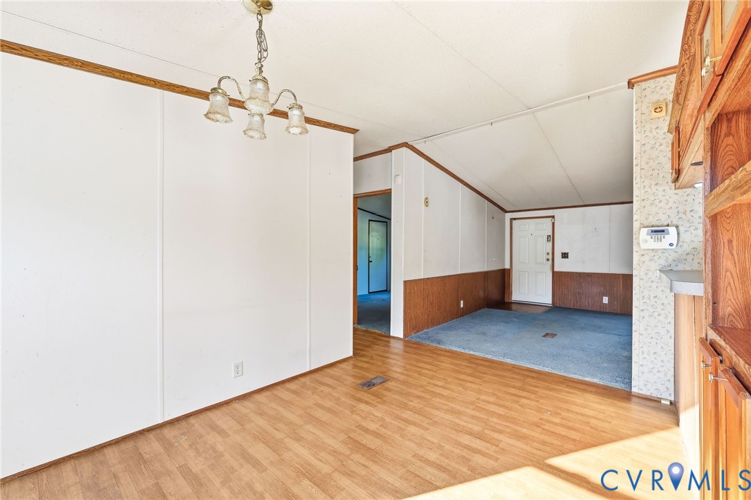 7410 Richmond Road Amelia Court House, VA 23002 - Photo 7 of 39 a view of a big room with wooden floor and windows