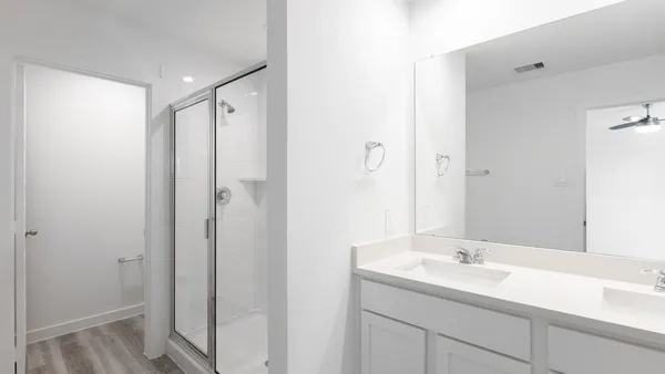 a bathroom with a sink and mirror