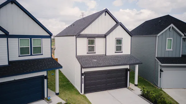a front view of a house with a garage