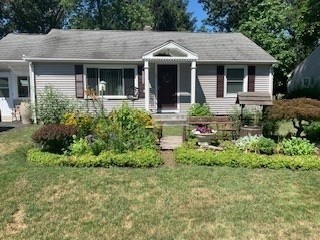 58 Maebeth Street Springfield, MA 01119 - Photo 1 of 22 a front view of a house with garden