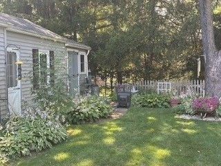 58 Maebeth Street Springfield, MA 01119 - Photo 11 of 22 a backyard of a house with lots of green space