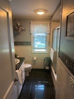58 Maebeth Street Springfield, MA 01119 - Photo 16 of 22 a bathroom with a toilet a sink and mirror