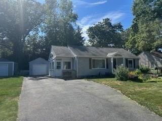 58 Maebeth Street Springfield, MA 01119 - Photo 2 of 22 a front view of a house with a garden