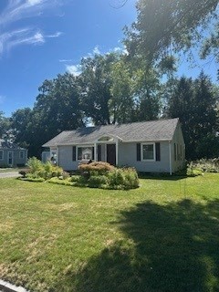58 Maebeth Street Springfield, MA 01119 - Photo 3 of 22 a front view of a house with a garden