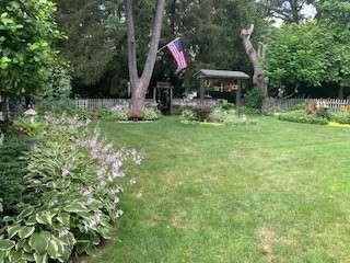 58 Maebeth Street Springfield, MA 01119 - Photo 8 of 22 a flag is sitting in the middle of a field
