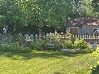 58 Maebeth Street Springfield, MA 01119 - Photo 9 of 22 a view of a house with a yard and a garden