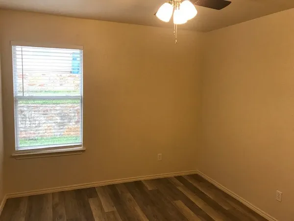 a bathroom with a sink vanity and mirror