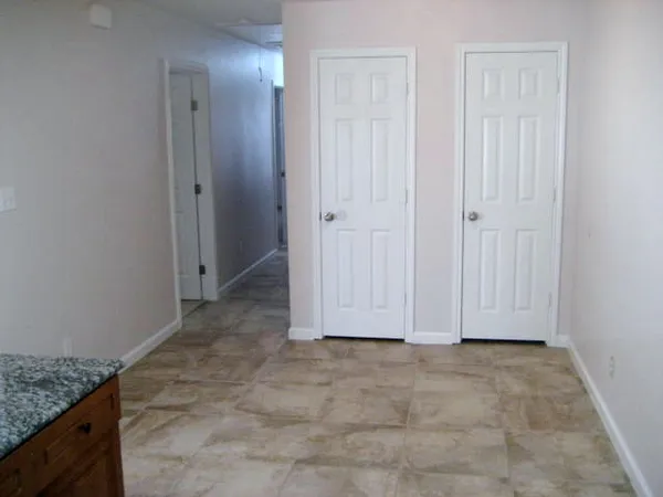 a kitchen with a refrigerator stove and microwave