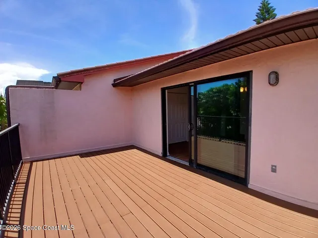 a balcony view with wooden floor