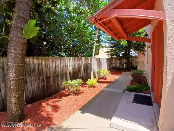 a view of a backyard with sitting area