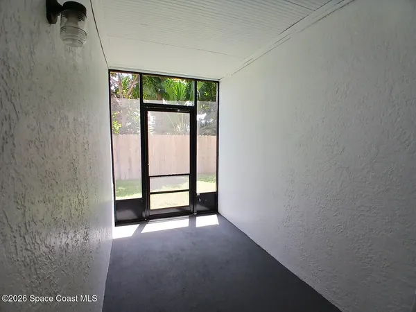 a view of empty room with windows