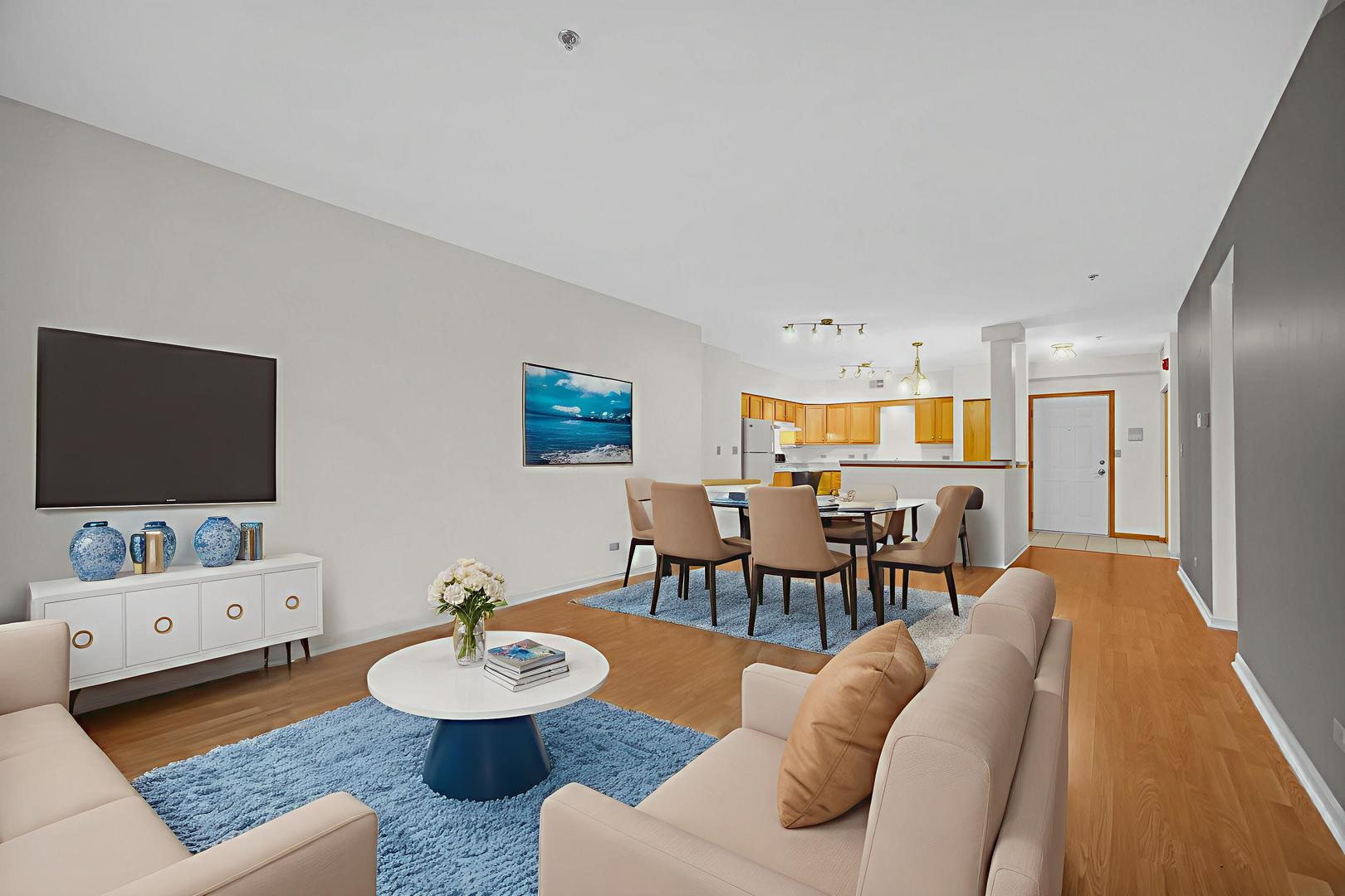 18065 Harwood Avenue, Unit A Homewood, IL 60430 - Photo 11 of 25 a living room with furniture and a flat screen tv