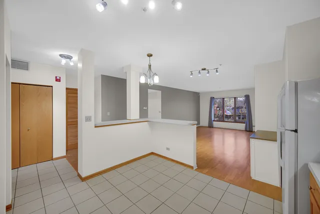 a view of a hallway with bathroom