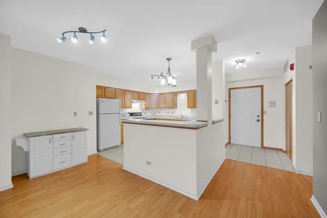 a view of a kitchen with wooden floor