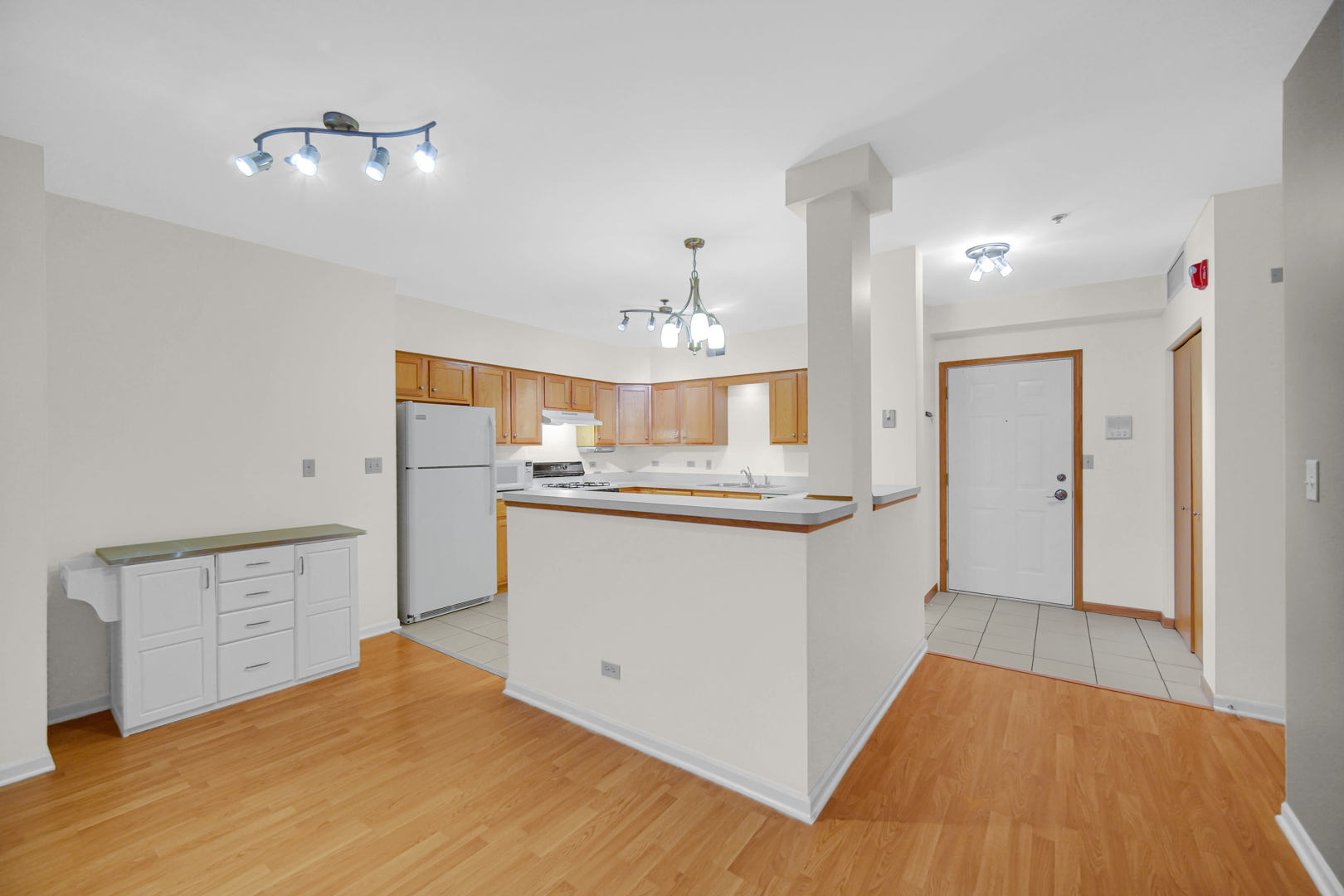 18065 Harwood Avenue, Unit A Homewood, IL 60430 - Photo 13 of 25 a view of a kitchen with wooden floor