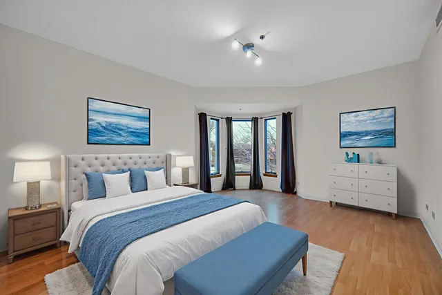 a bedroom with a large bed and a couch