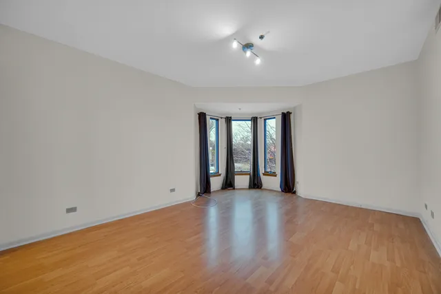 a view of an empty room with glass door