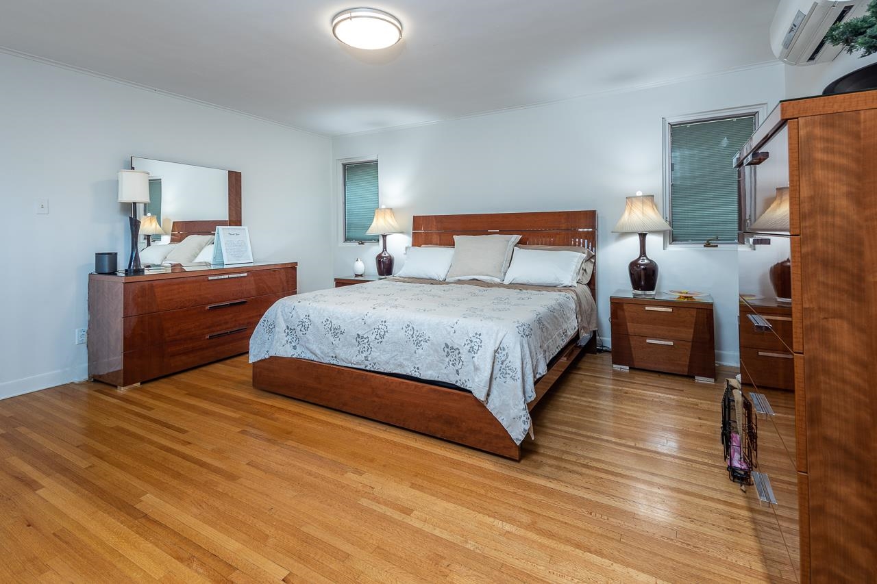 110 Wallace Road Memphis, TN 38117 - Photo 14 of 25 a bedroom with a bed and a night stand