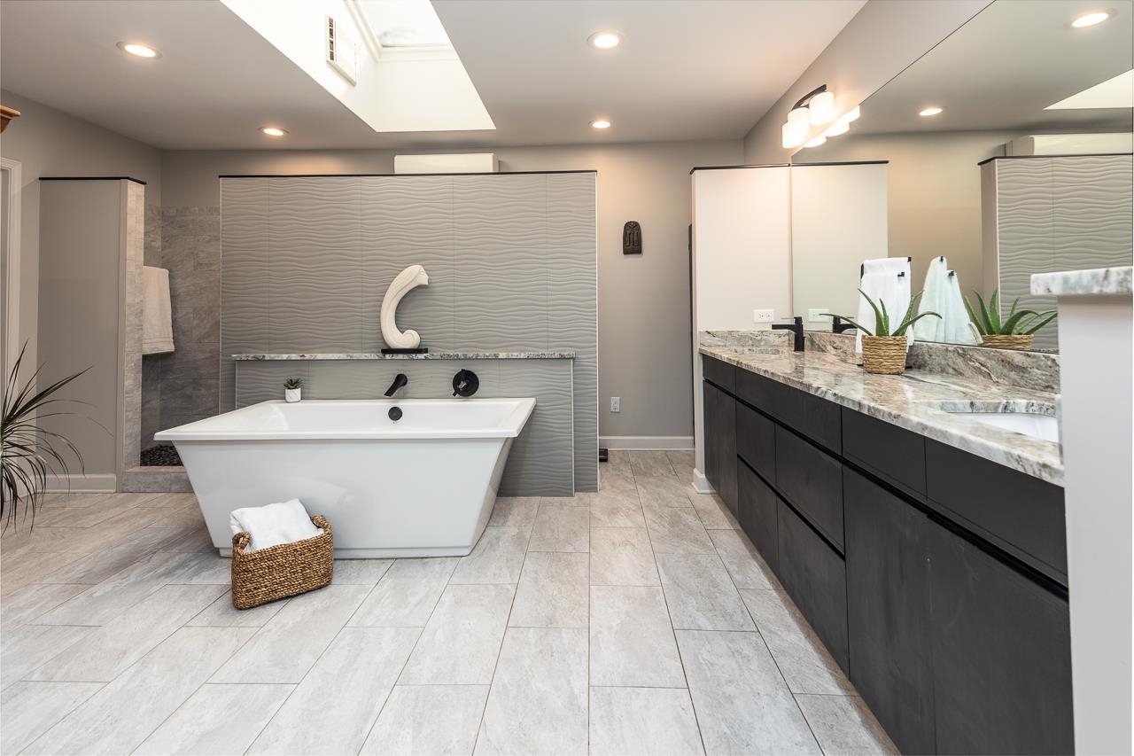 110 Wallace Road Memphis, TN 38117 - Photo 15 of 25 a bathroom with a double vanity sink and a mirror