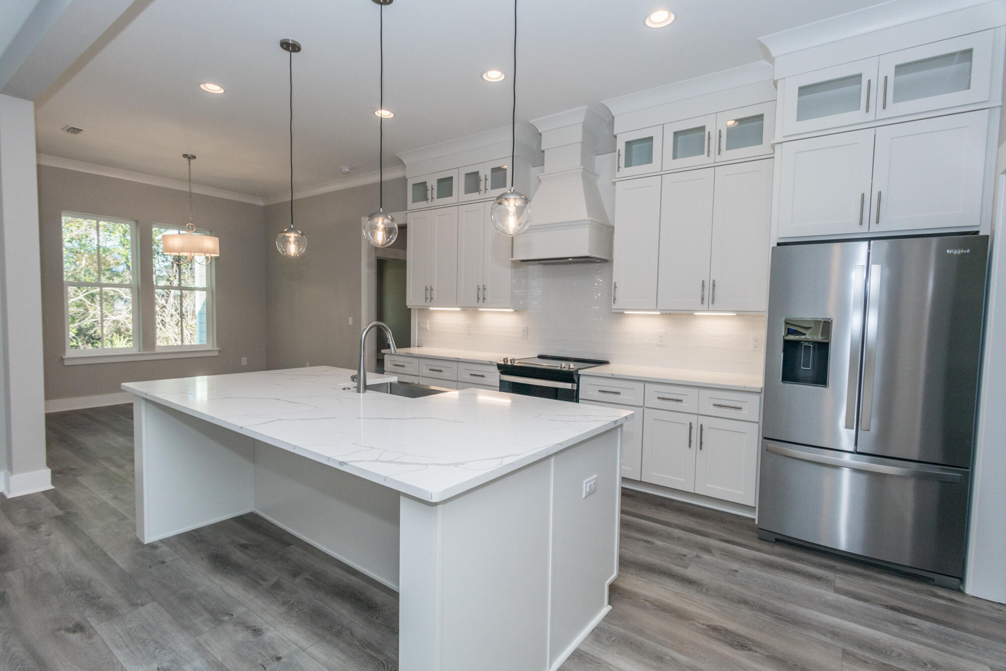 190 Bear Creek Boulevard Freeport, FL 32439 - Photo 10 of 85 a kitchen with kitchen island a sink stainless steel appliances and refrigerator