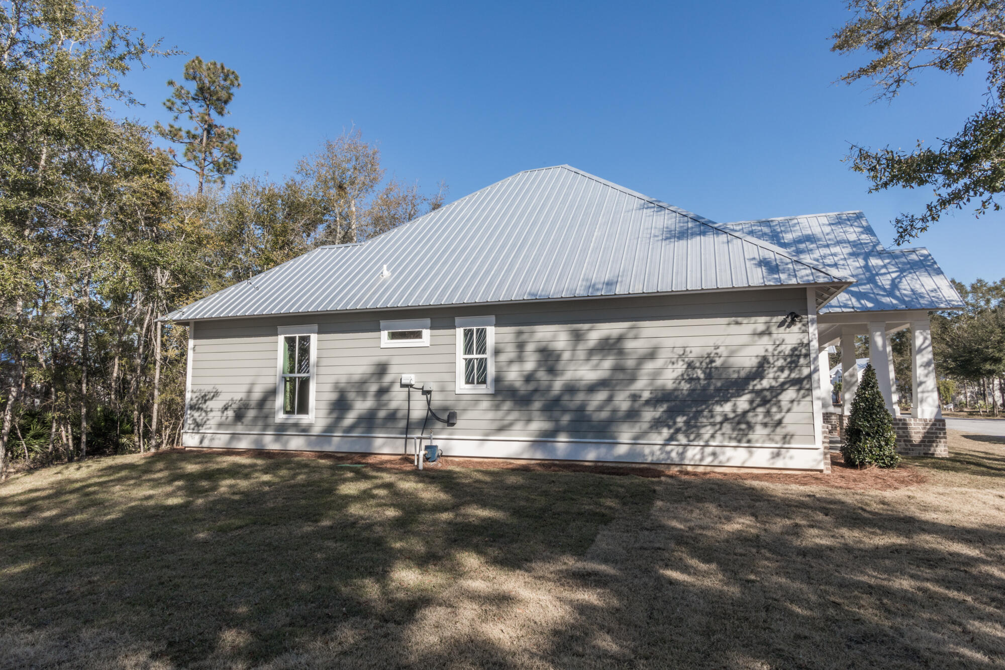 190 Bear Creek Boulevard Freeport, FL 32439 - Photo 16 of 85 a front view of a house with a yard