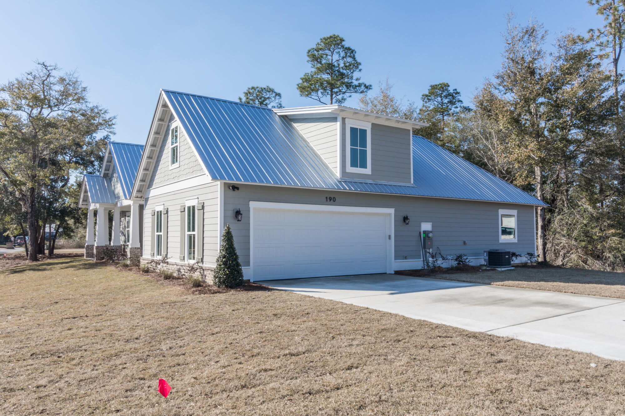 190 Bear Creek Boulevard Freeport, FL 32439 - Photo 18 of 85 a front view of a house with a yard and garage