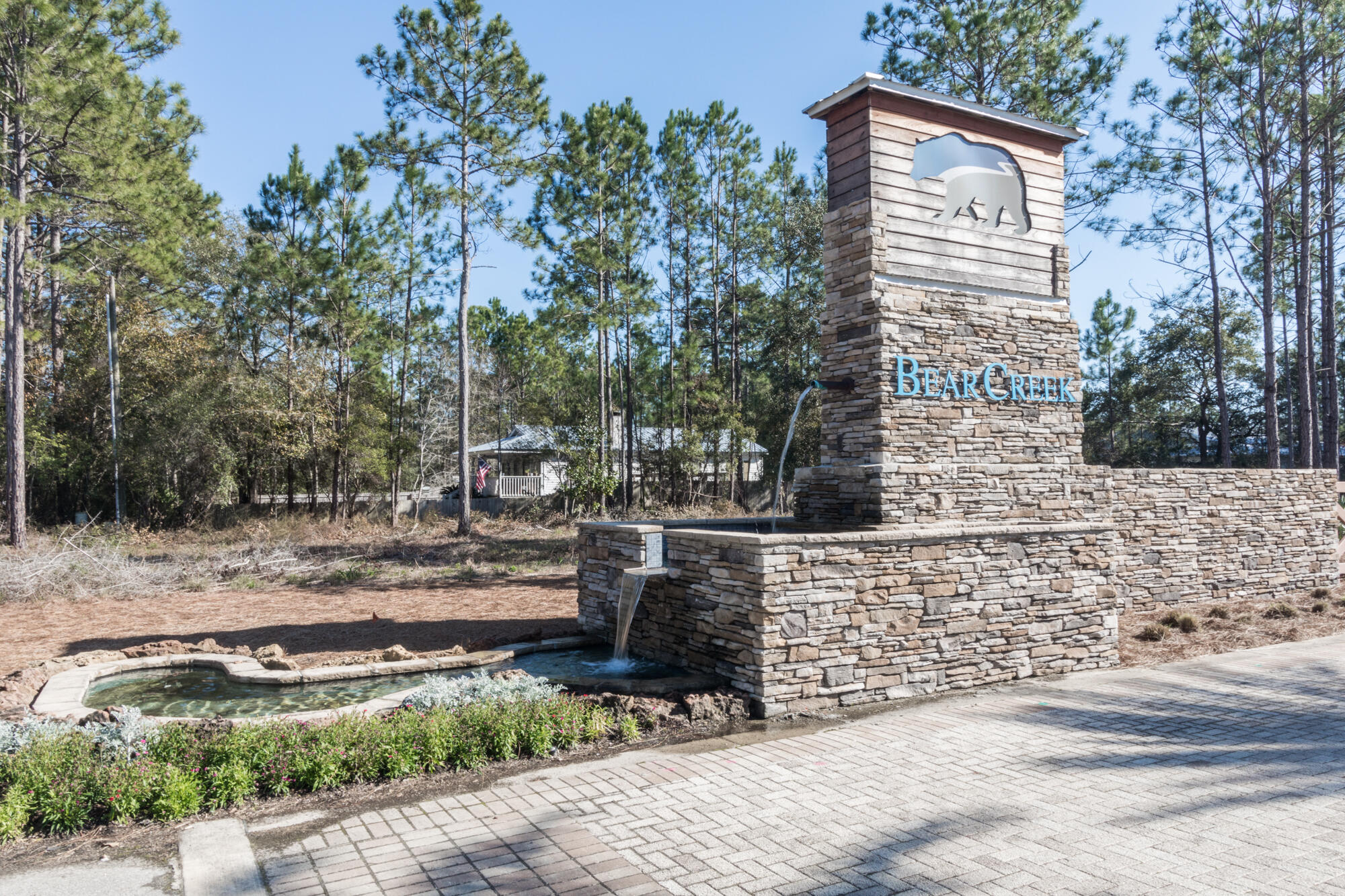 190 Bear Creek Boulevard Freeport, FL 32439 - Photo 2 of 85 a backyard of a house with large trees and wooden fence