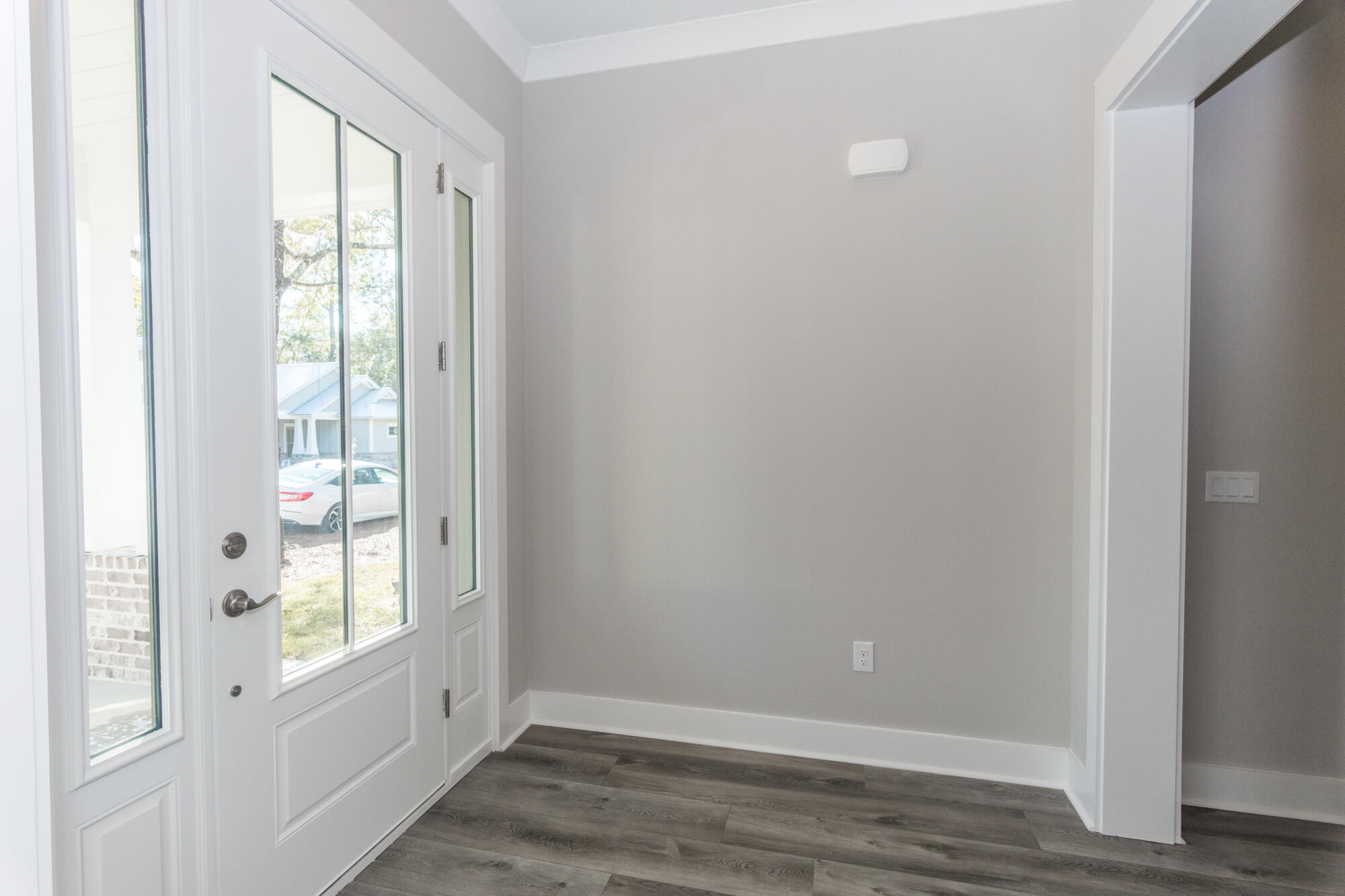 190 Bear Creek Boulevard Freeport, FL 32439 - Photo 20 of 85 a view of an empty room with wooden floor and a window