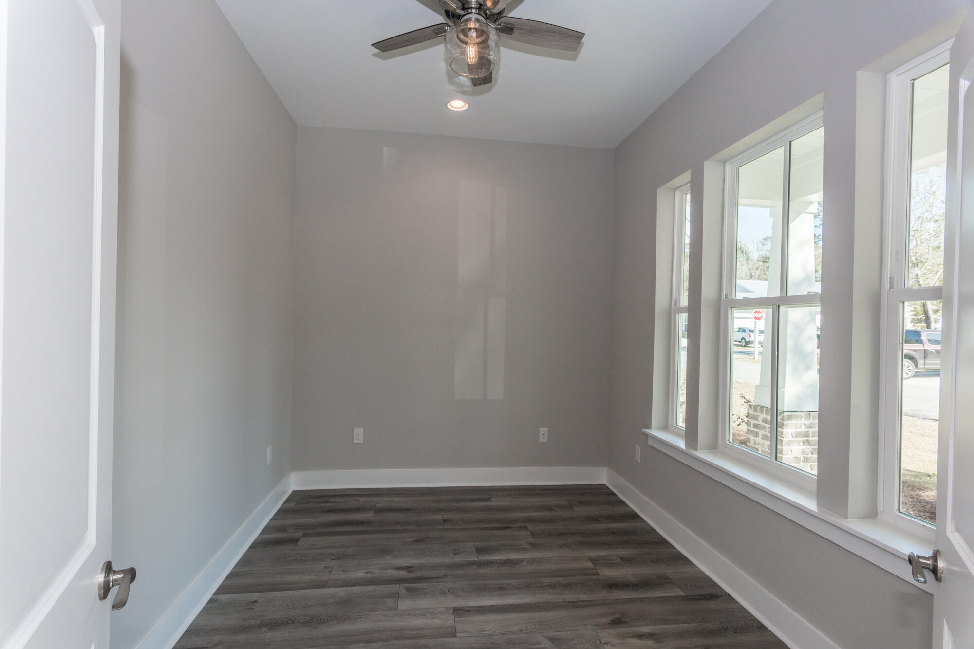 190 Bear Creek Boulevard Freeport, FL 32439 - Photo 22 of 85 wooden floor in an empty room with a window