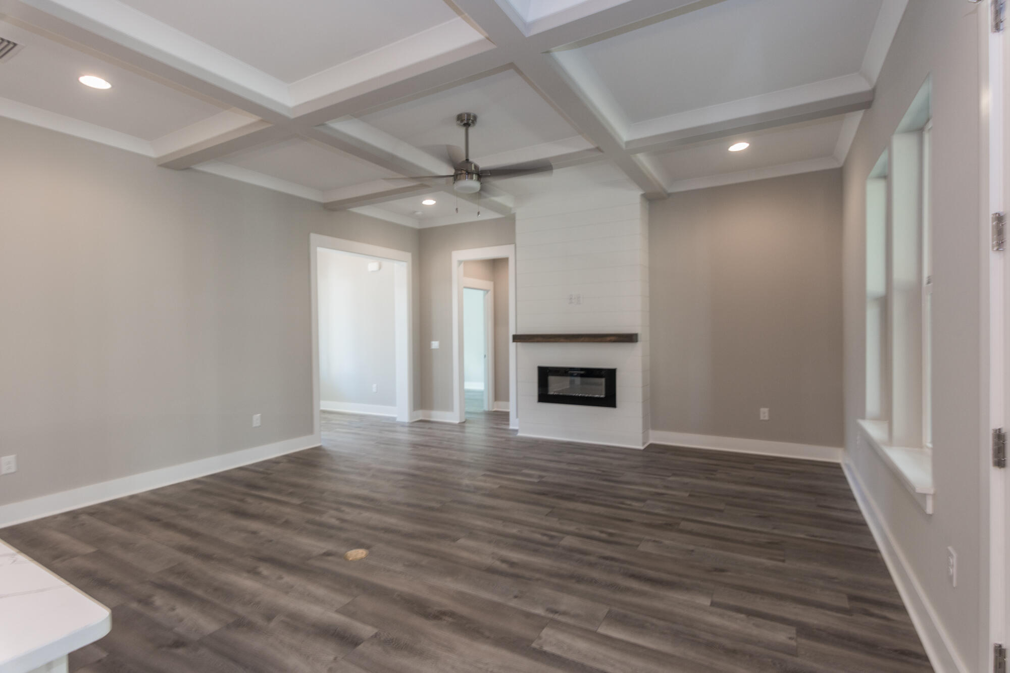 190 Bear Creek Boulevard Freeport, FL 32439 - Photo 23 of 85 an empty room with wooden floor fireplace and windows