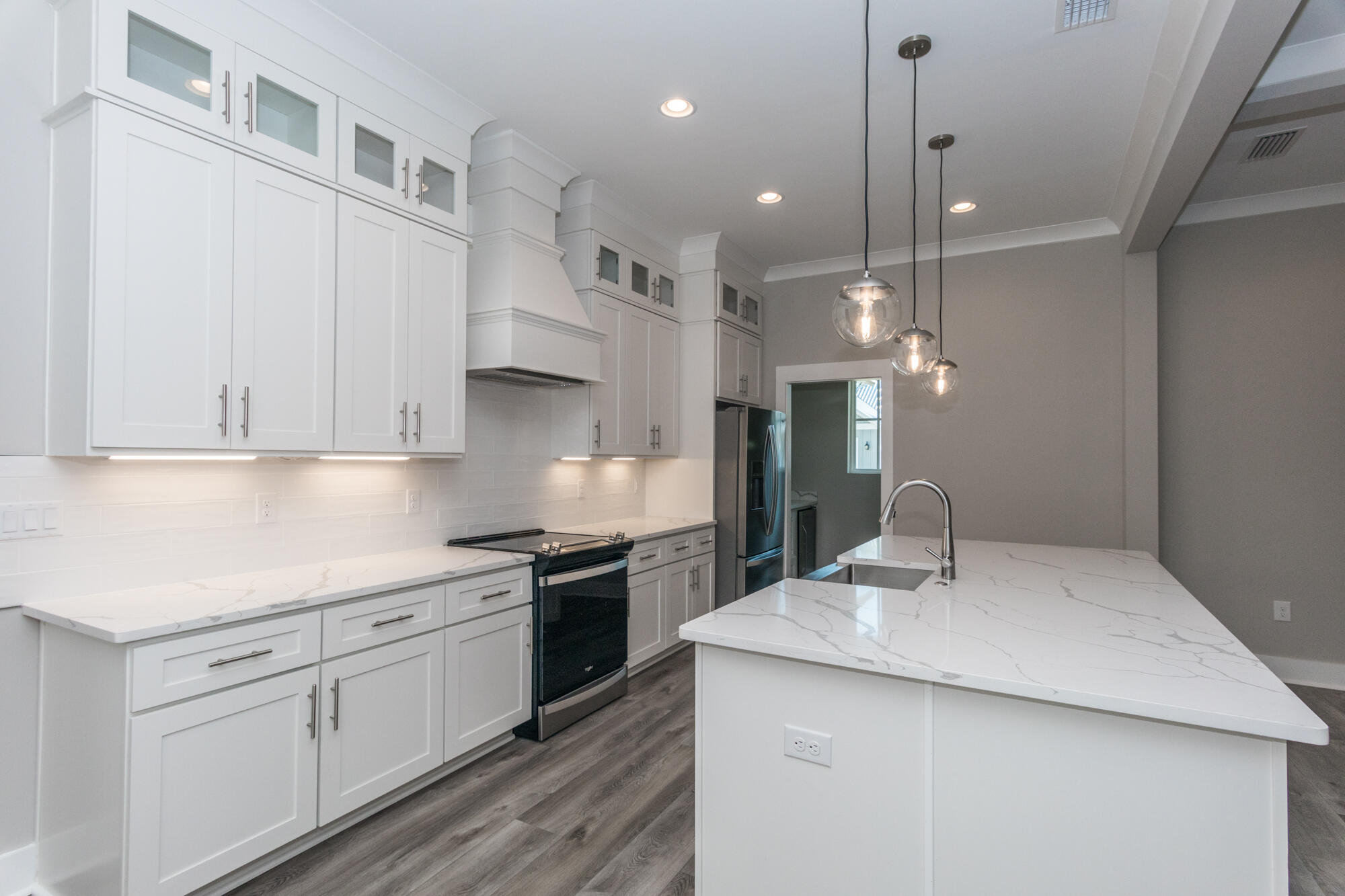 190 Bear Creek Boulevard Freeport, FL 32439 - Photo 24 of 85 a kitchen with a sink stainless steel appliances and cabinets