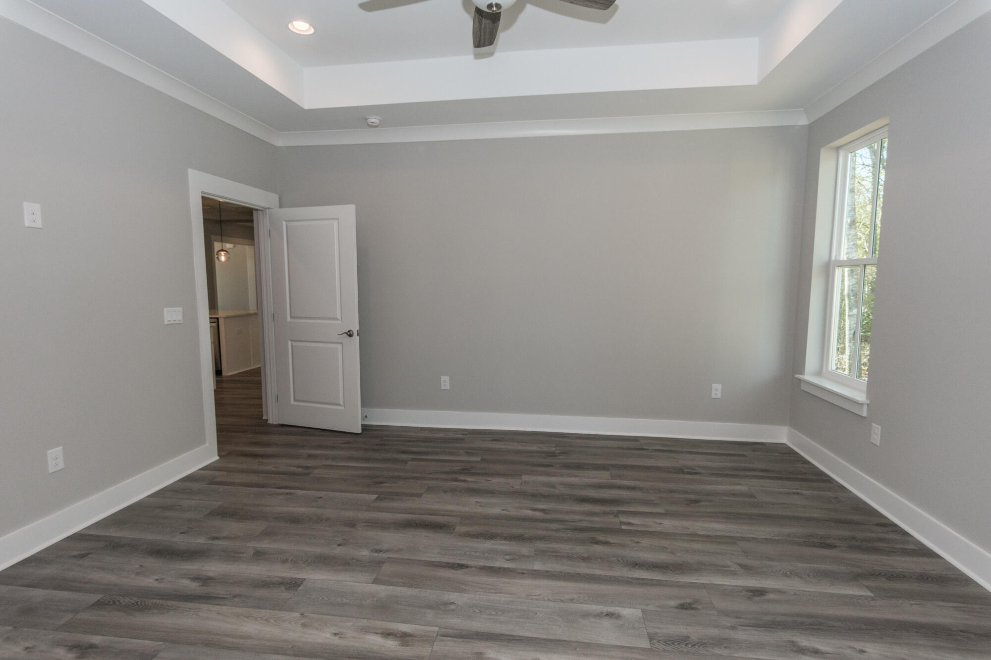 190 Bear Creek Boulevard Freeport, FL 32439 - Photo 28 of 85 a view of an empty room with wooden floor and a window