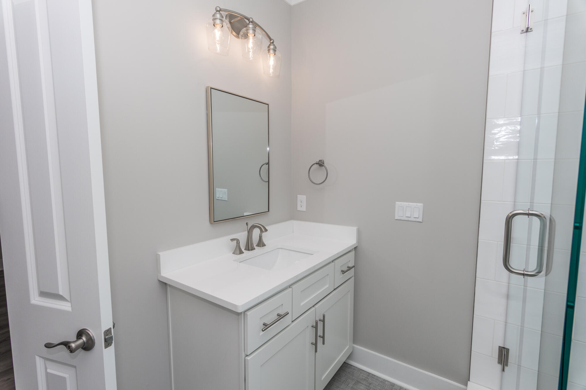 190 Bear Creek Boulevard Freeport, FL 32439 - Photo 36 of 85 a bathroom with a sink a light fixture and a mirror