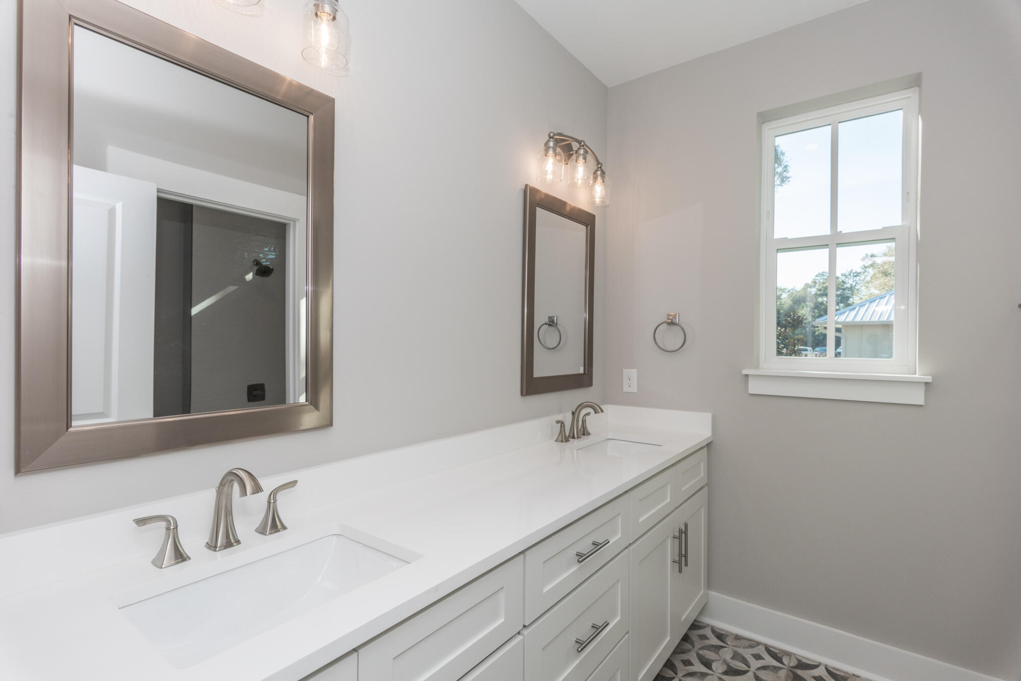 190 Bear Creek Boulevard Freeport, FL 32439 - Photo 42 of 85 a bathroom with a sink and a mirror
