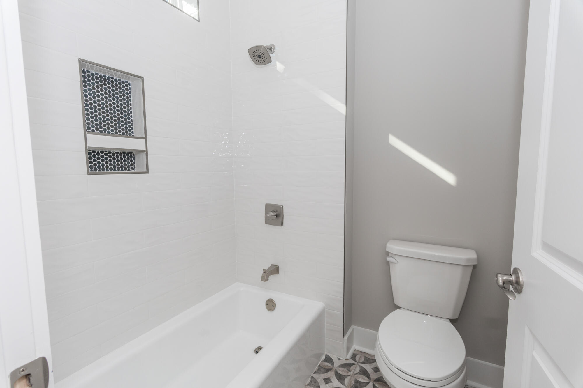 190 Bear Creek Boulevard Freeport, FL 32439 - Photo 43 of 85 a white toilet sitting next to a bathroom sink and tub