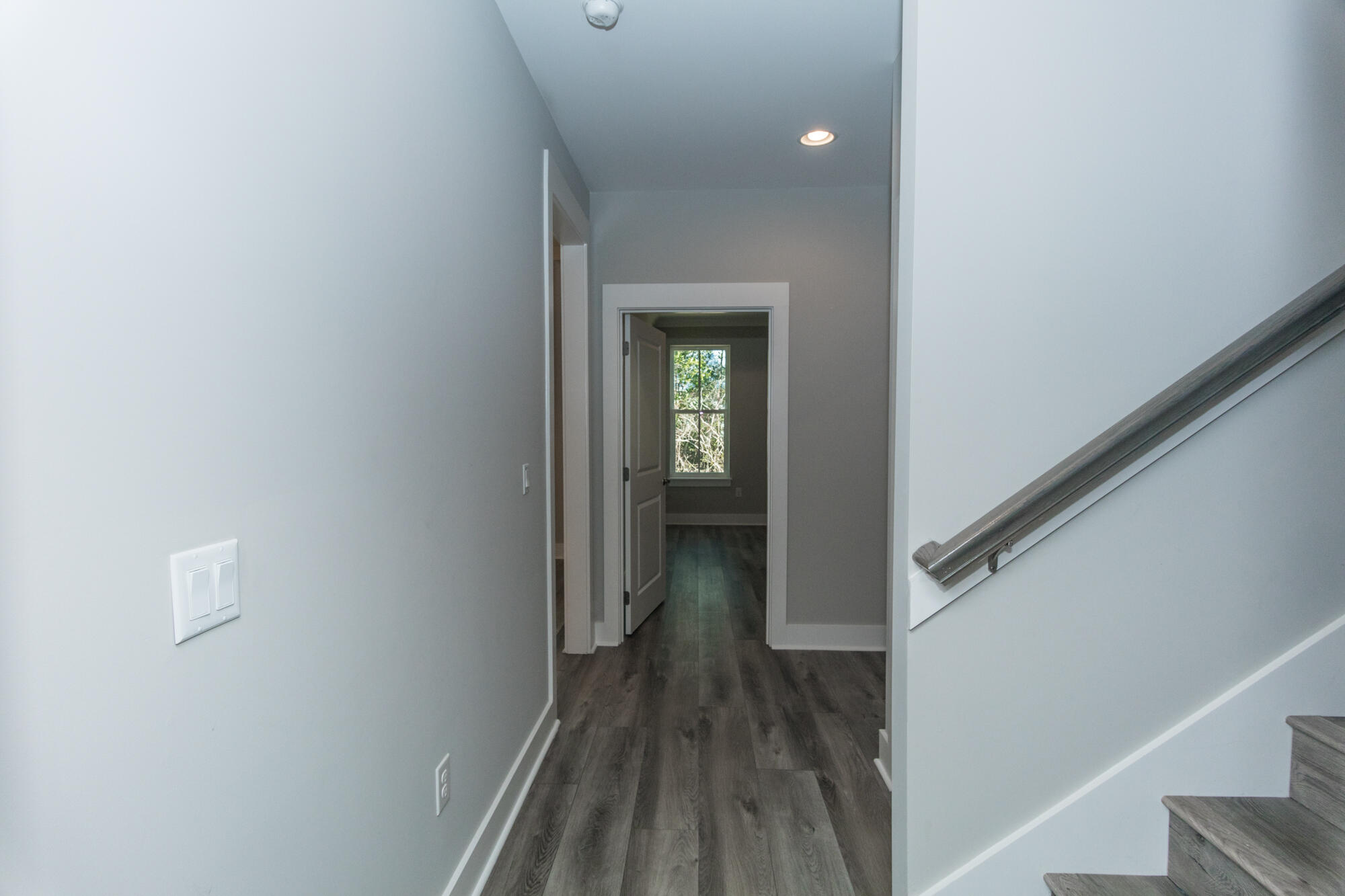 190 Bear Creek Boulevard Freeport, FL 32439 - Photo 46 of 85 a view of a hallway with wooden floor and staircase