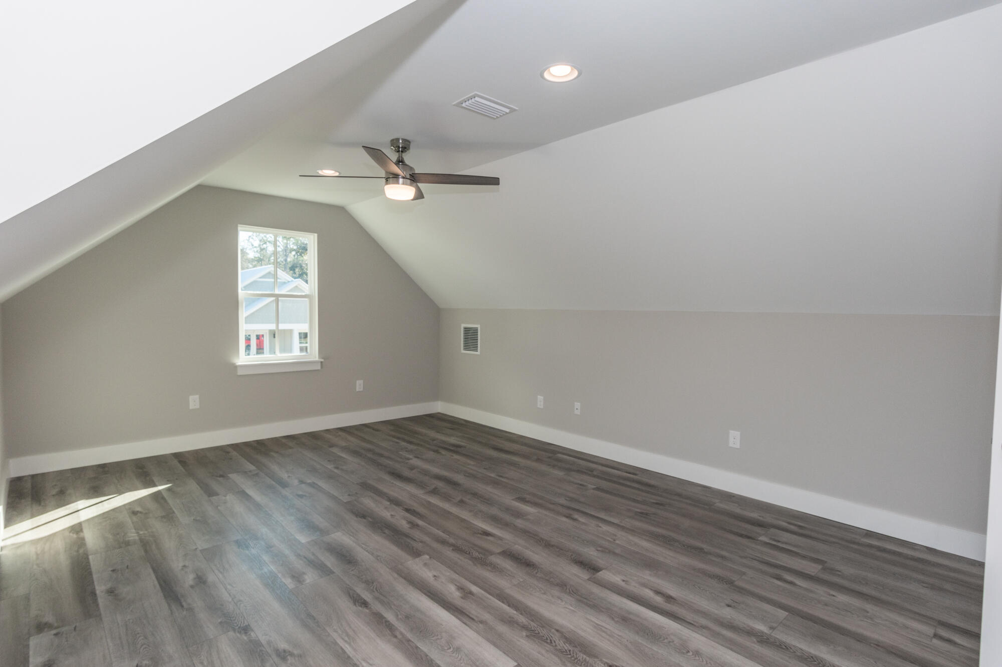 190 Bear Creek Boulevard Freeport, FL 32439 - Photo 52 of 85 an empty room with wooden floor and windows