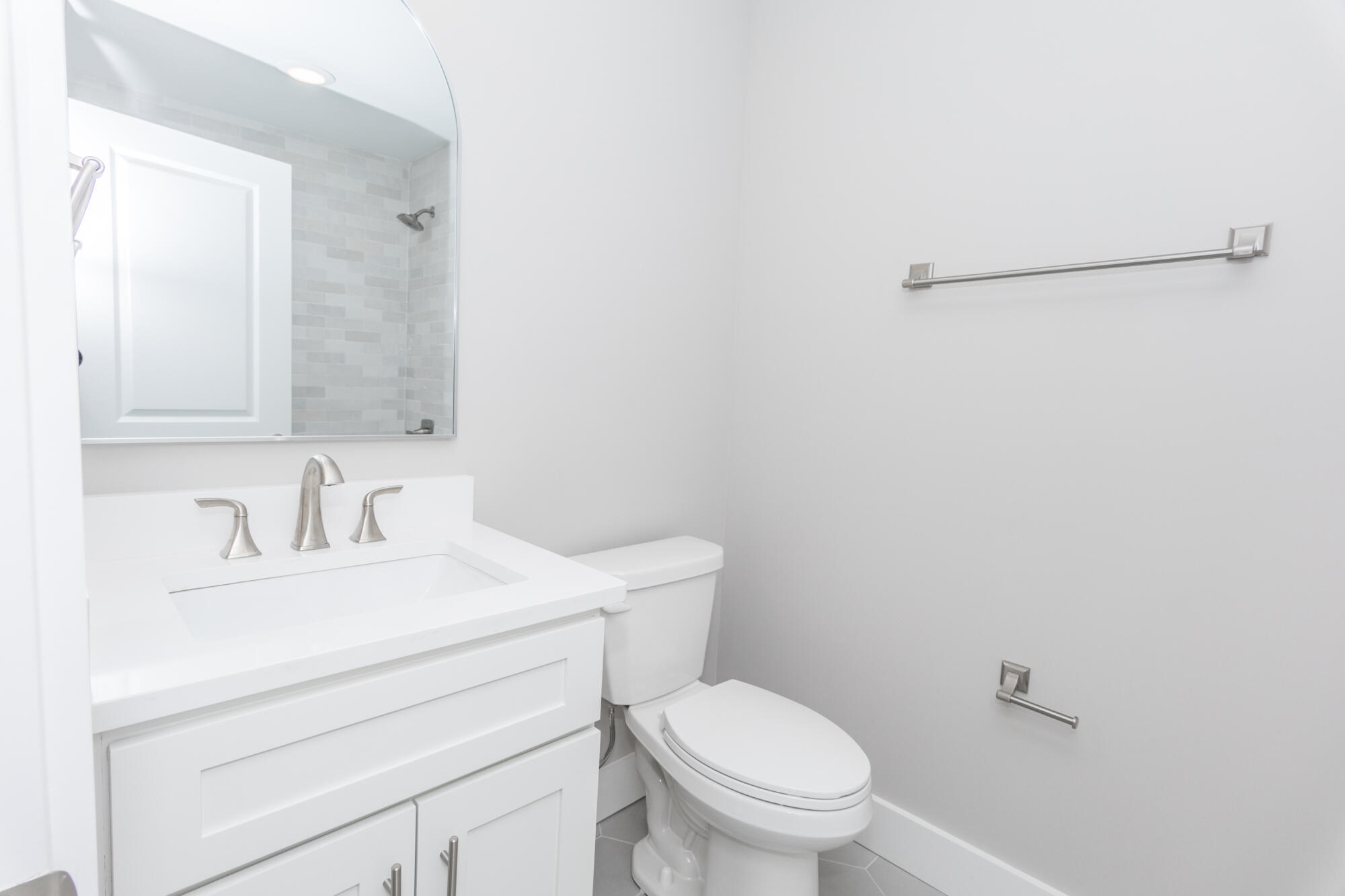 190 Bear Creek Boulevard Freeport, FL 32439 - Photo 55 of 85 a bathroom with a toilet sink vanity and mirror