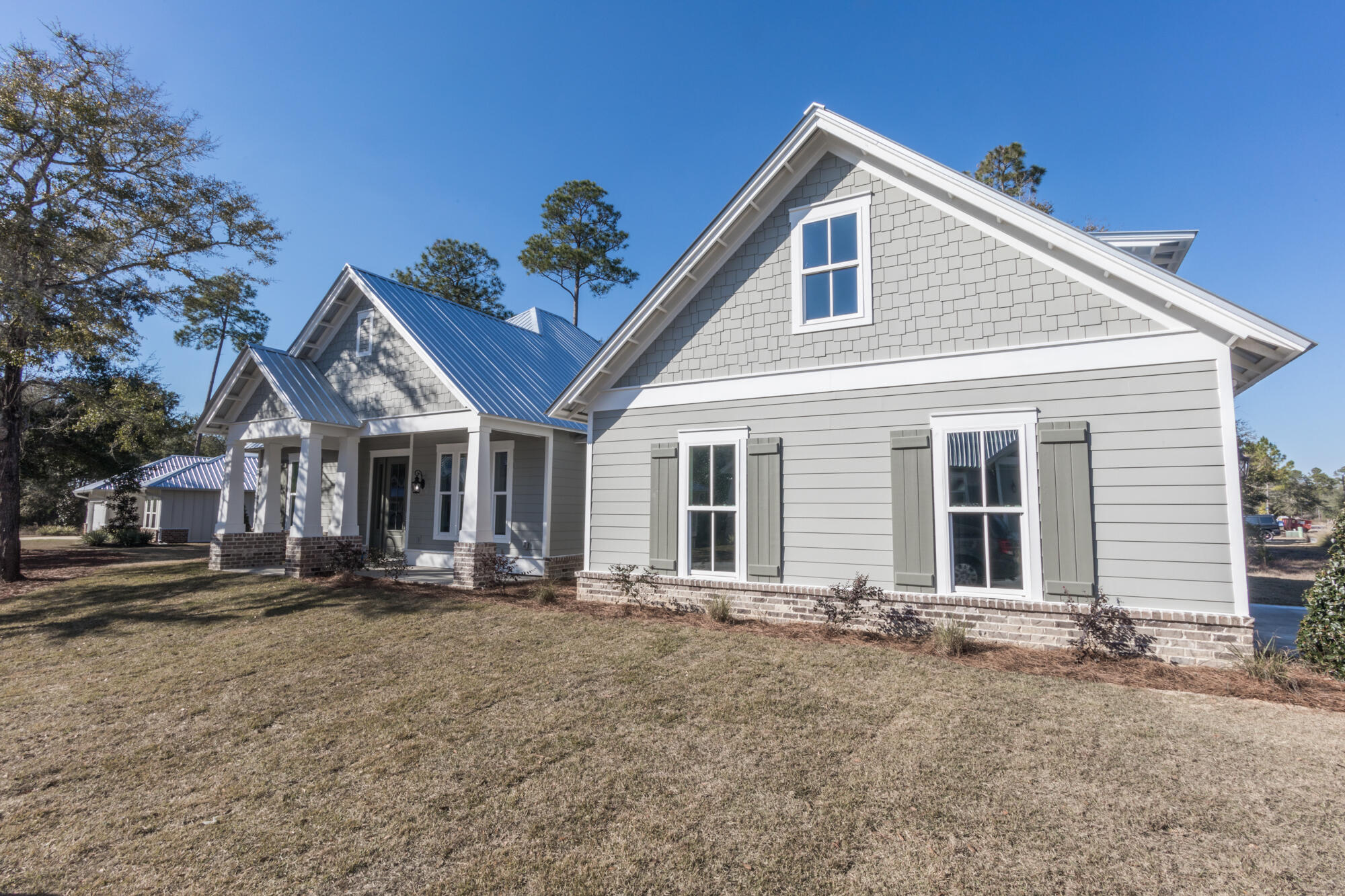 190 Bear Creek Boulevard Freeport, FL 32439 - Photo 7 of 85 a front view of a house with a yard