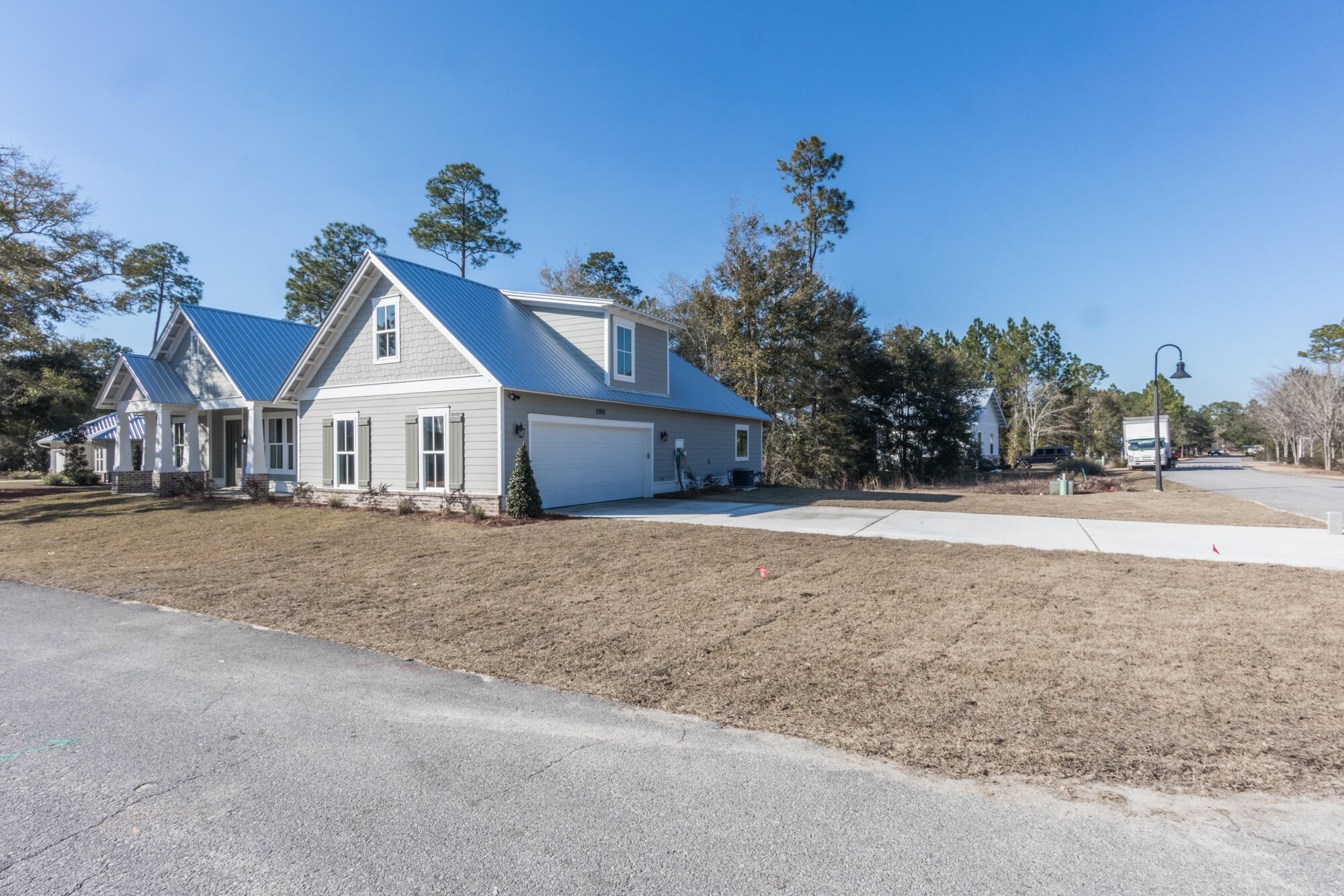 190 Bear Creek Boulevard Freeport, FL 32439 - Photo 9 of 85 a front view of a house with a yard and garage