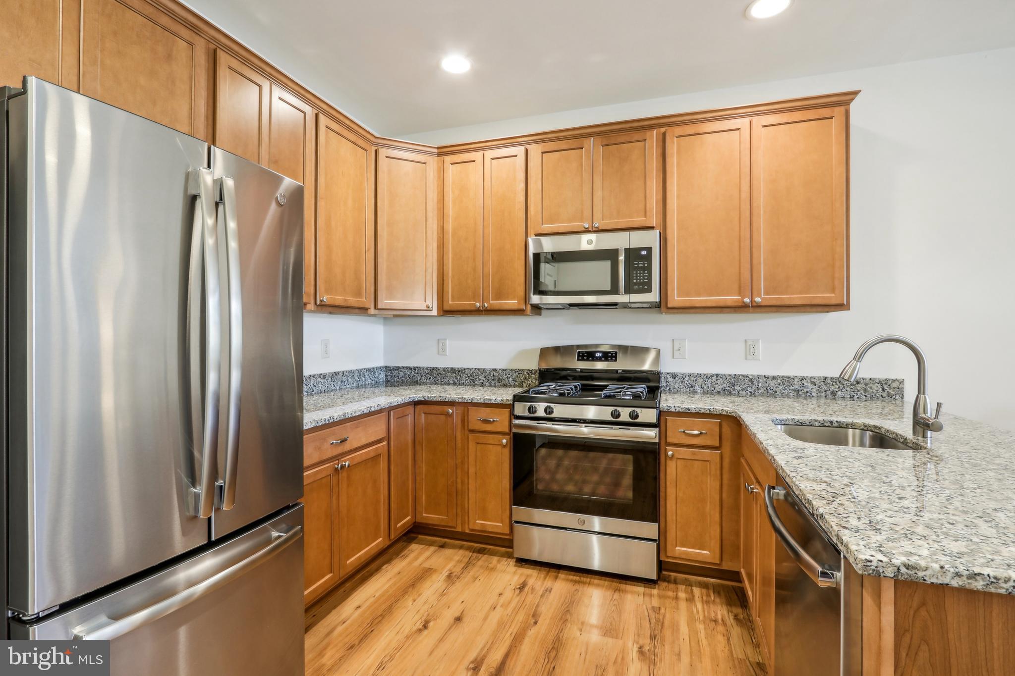 509 Ridgeview Court Sellersville, PA 18960 - Photo 3 of 20 a kitchen with stainless steel appliances granite countertop a refrigerator stove and sink