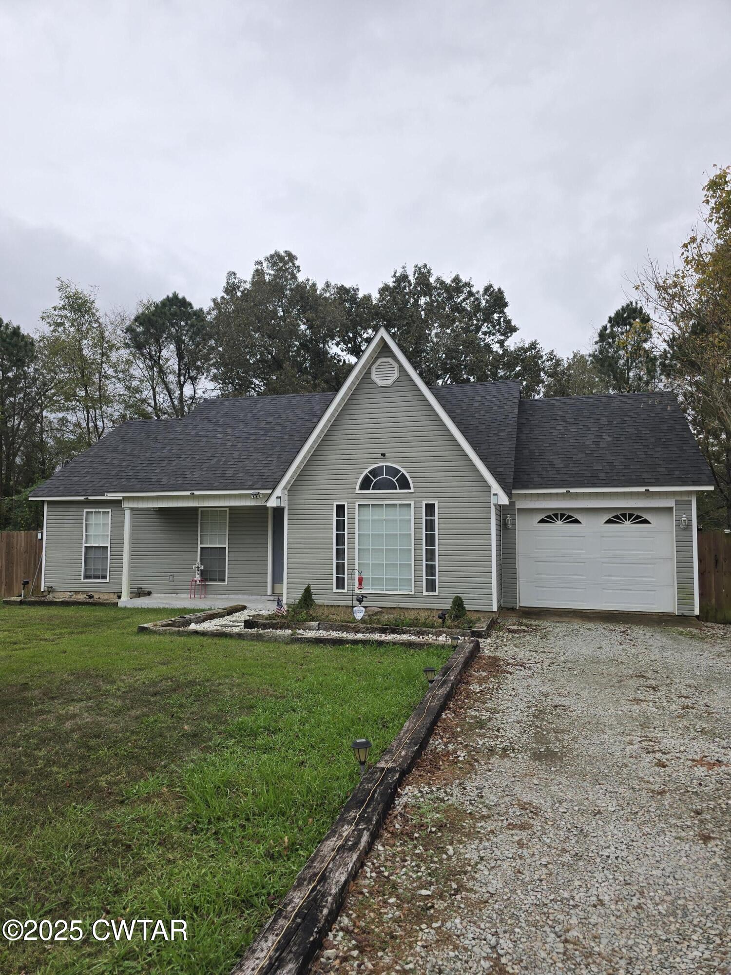 143 Elizabeth Cove Selmer, TN 38375 - Photo 1 of 14 front view of house with a yard