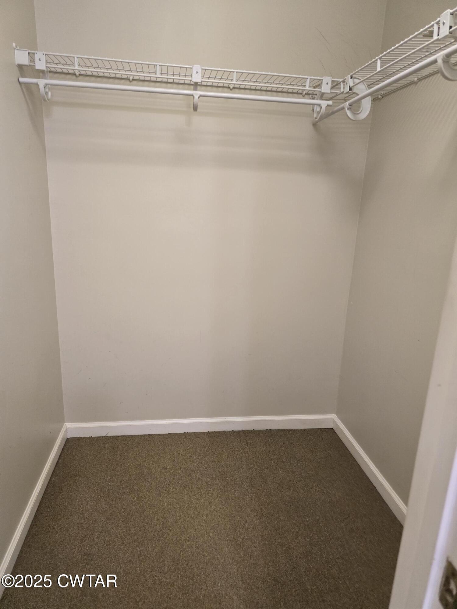 143 Elizabeth Cove Selmer, TN 38375 - Photo 11 of 14 a view of a room with racks on the wall