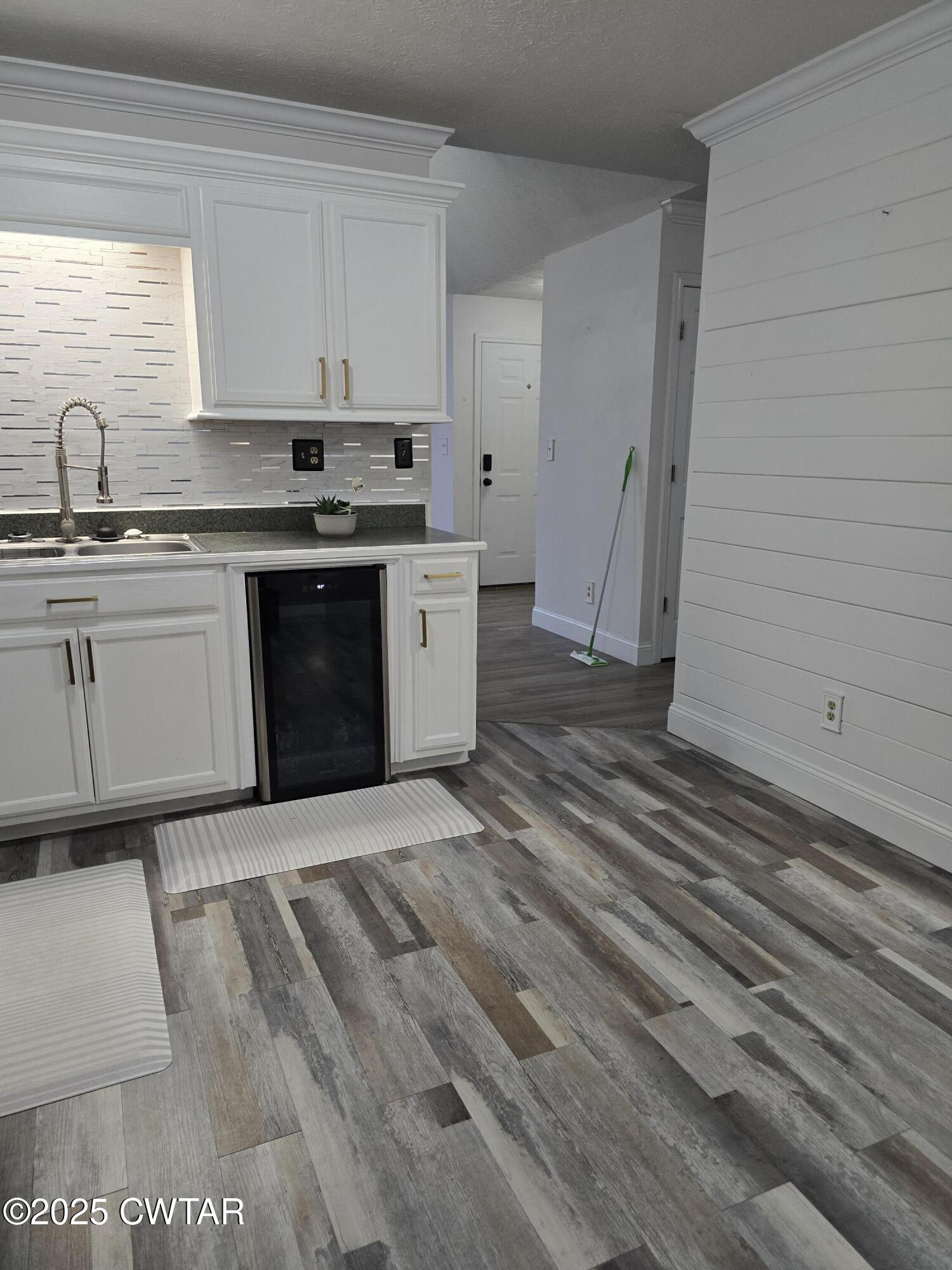 143 Elizabeth Cove Selmer, TN 38375 - Photo 3 of 14 a kitchen with a sink stove and cabinets