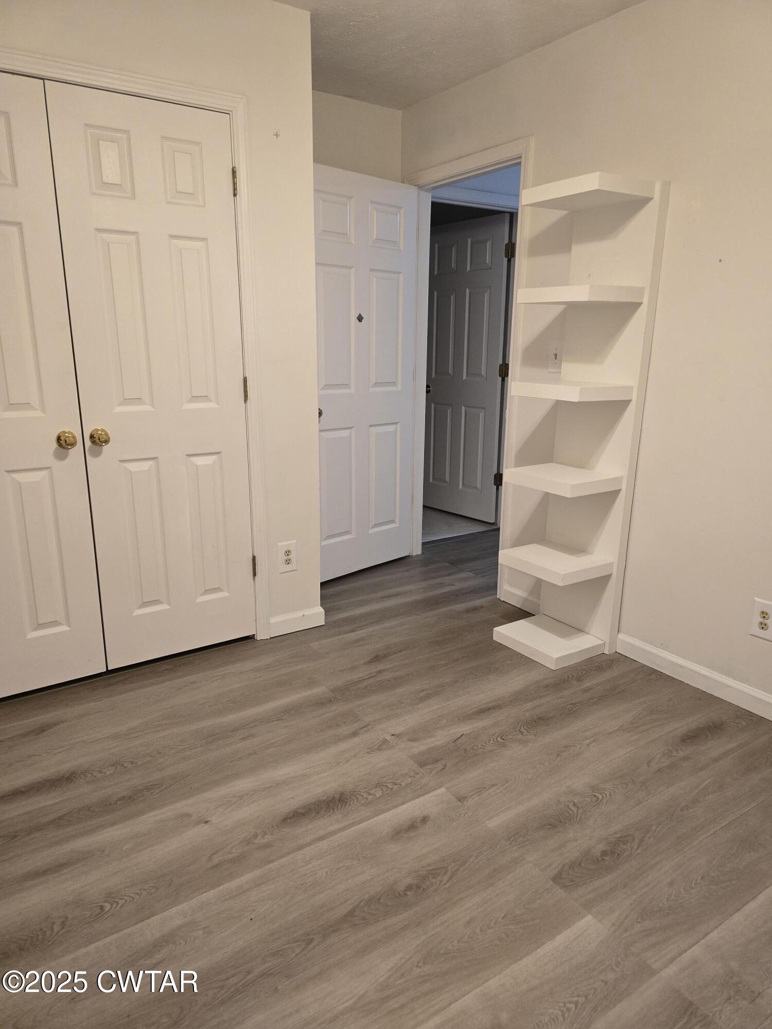 143 Elizabeth Cove Selmer, TN 38375 - Photo 7 of 14 a view of an empty room with a closet