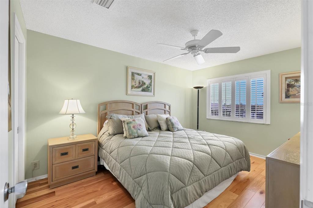 9011 Midnight Pass Road, Unit 426 Sarasota, FL 34242 - Photo 24 of 53 a bedroom with a bed and a window