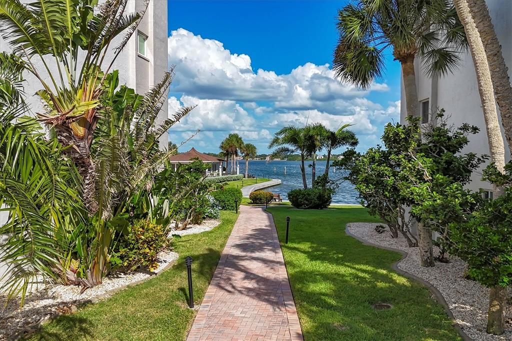 9011 Midnight Pass Road, Unit 426 Sarasota, FL 34242 - Photo 29 of 53 a view of a pathway with a big yard
