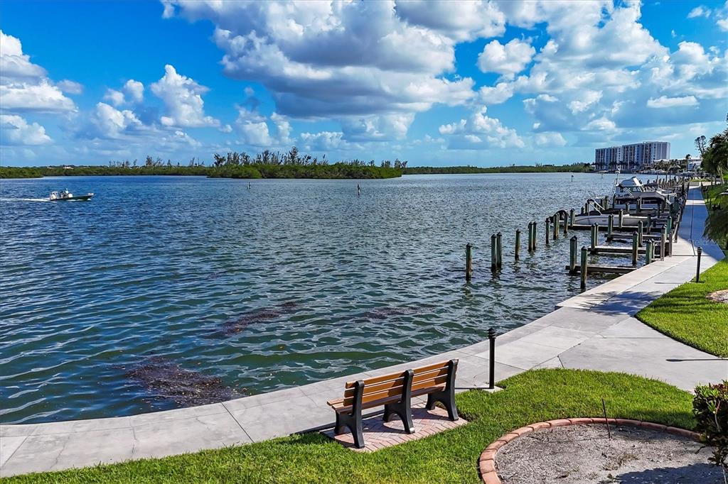 9011 Midnight Pass Road, Unit 426 Sarasota, FL 34242 - Photo 30 of 53 a view of a lake with outdoor seating